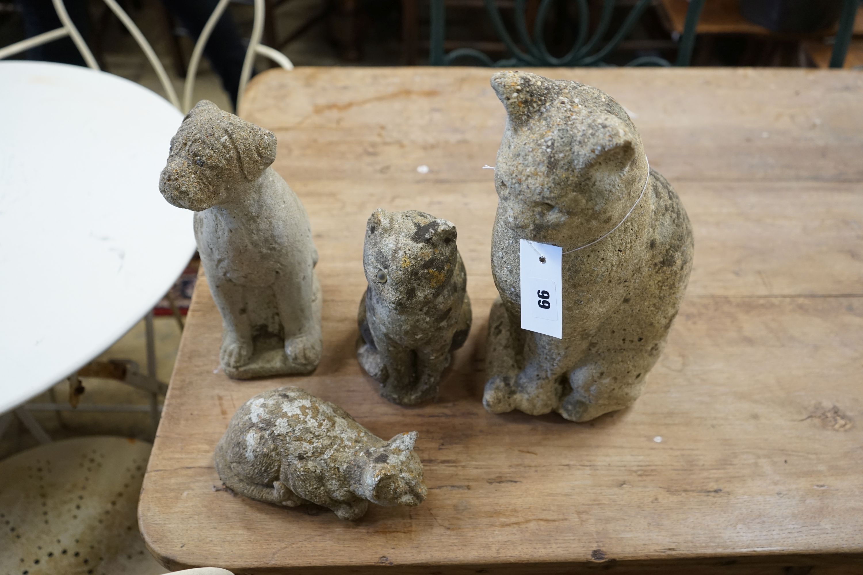 Four reconstituted stone cat and puppy garden ornaments, largest height 33cm